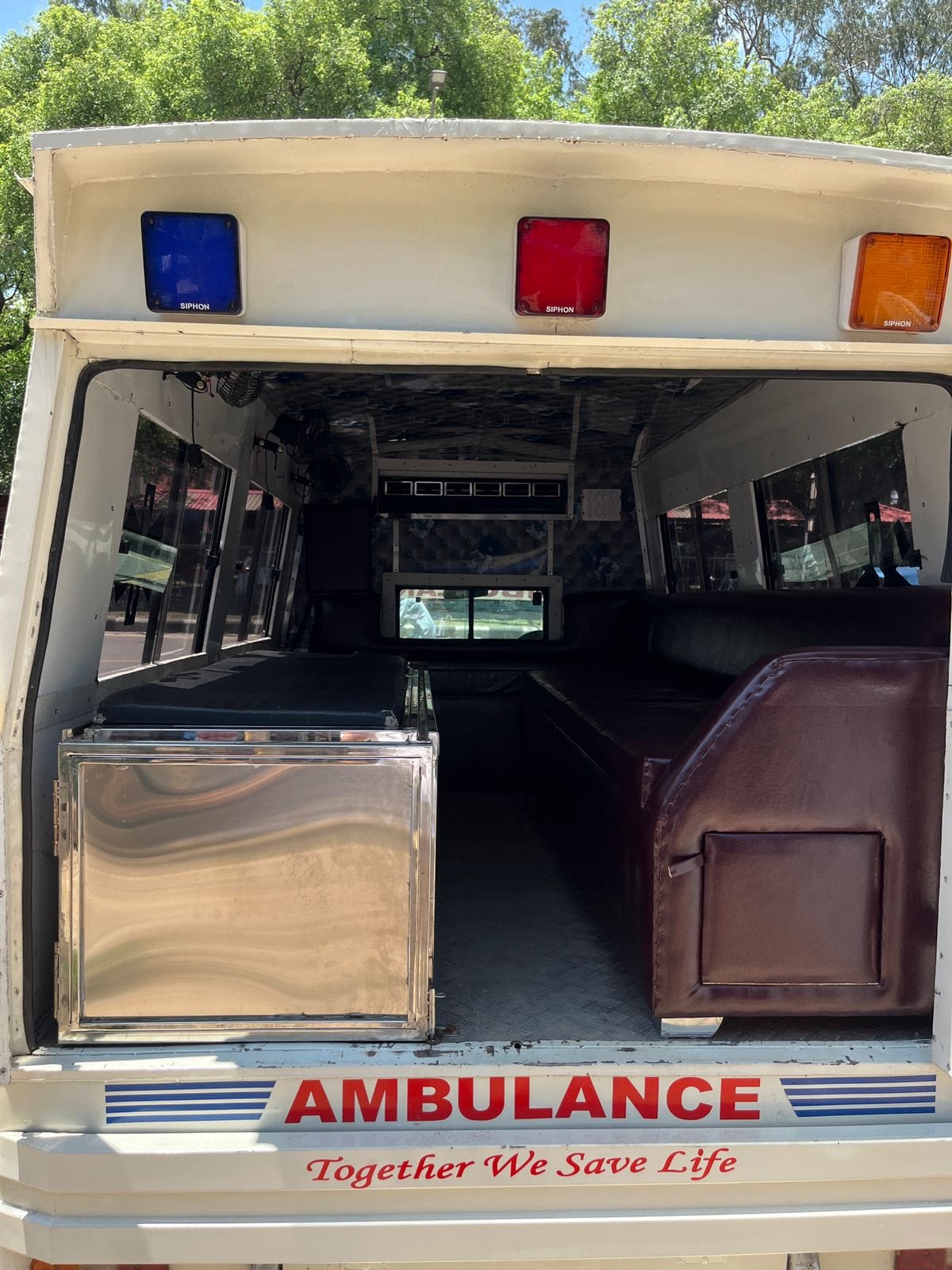 Ambulance interior with stretcher and seating